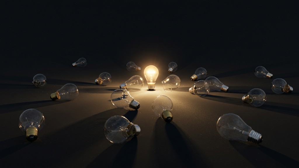 One lit light bulb standing among many unlit bulbs
